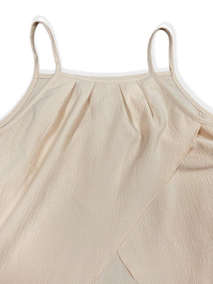 a woman's top with straps on the back of it
