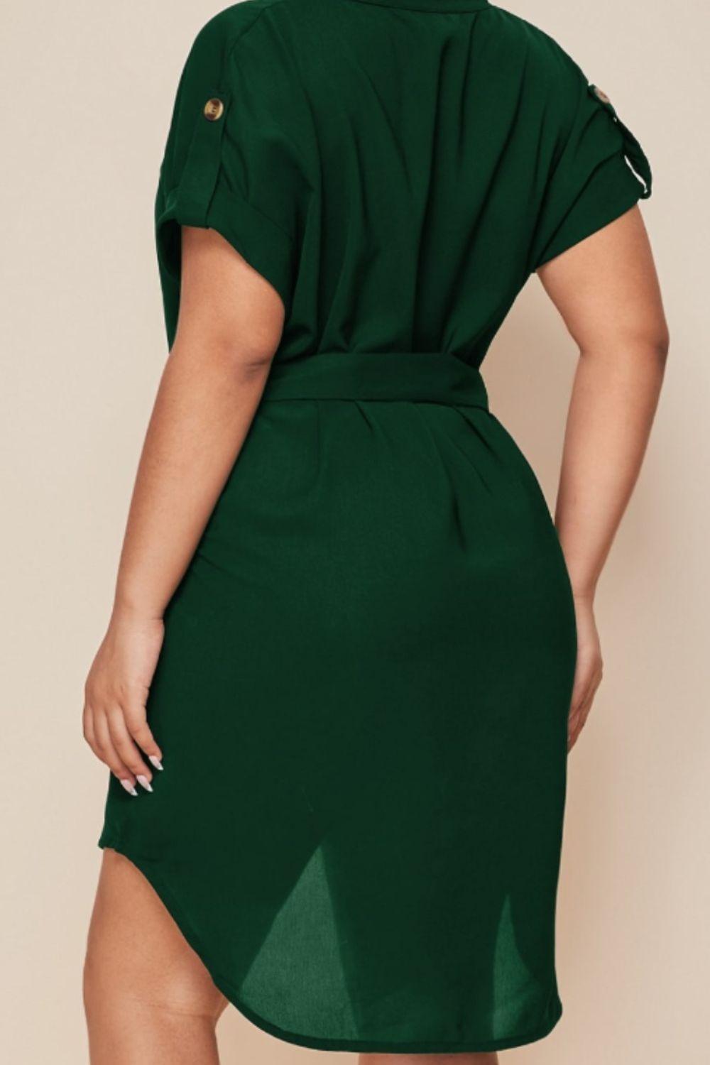 a woman in a green shirt dress