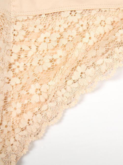 a close up of a piece of lace on a white surface