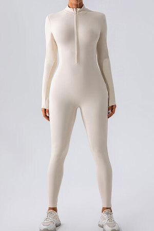 a woman in a white bodysuit with a zipper