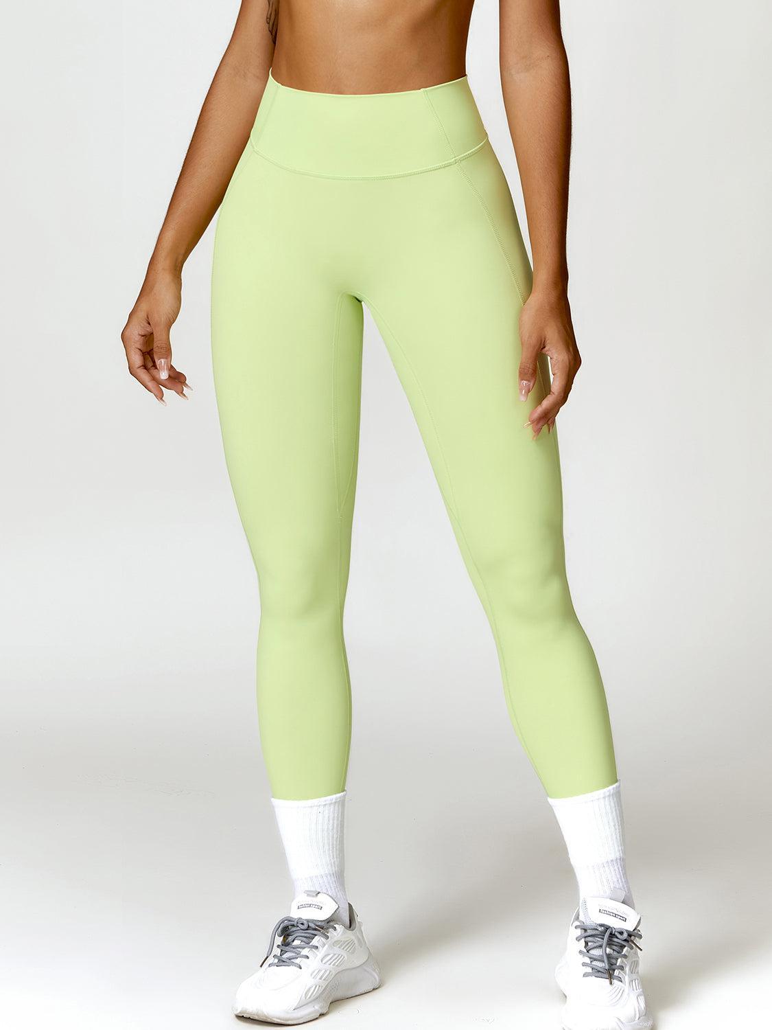 a woman in a sports bra top and neon green leggings