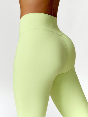 a close up of a woman's butt in a tight green leggings