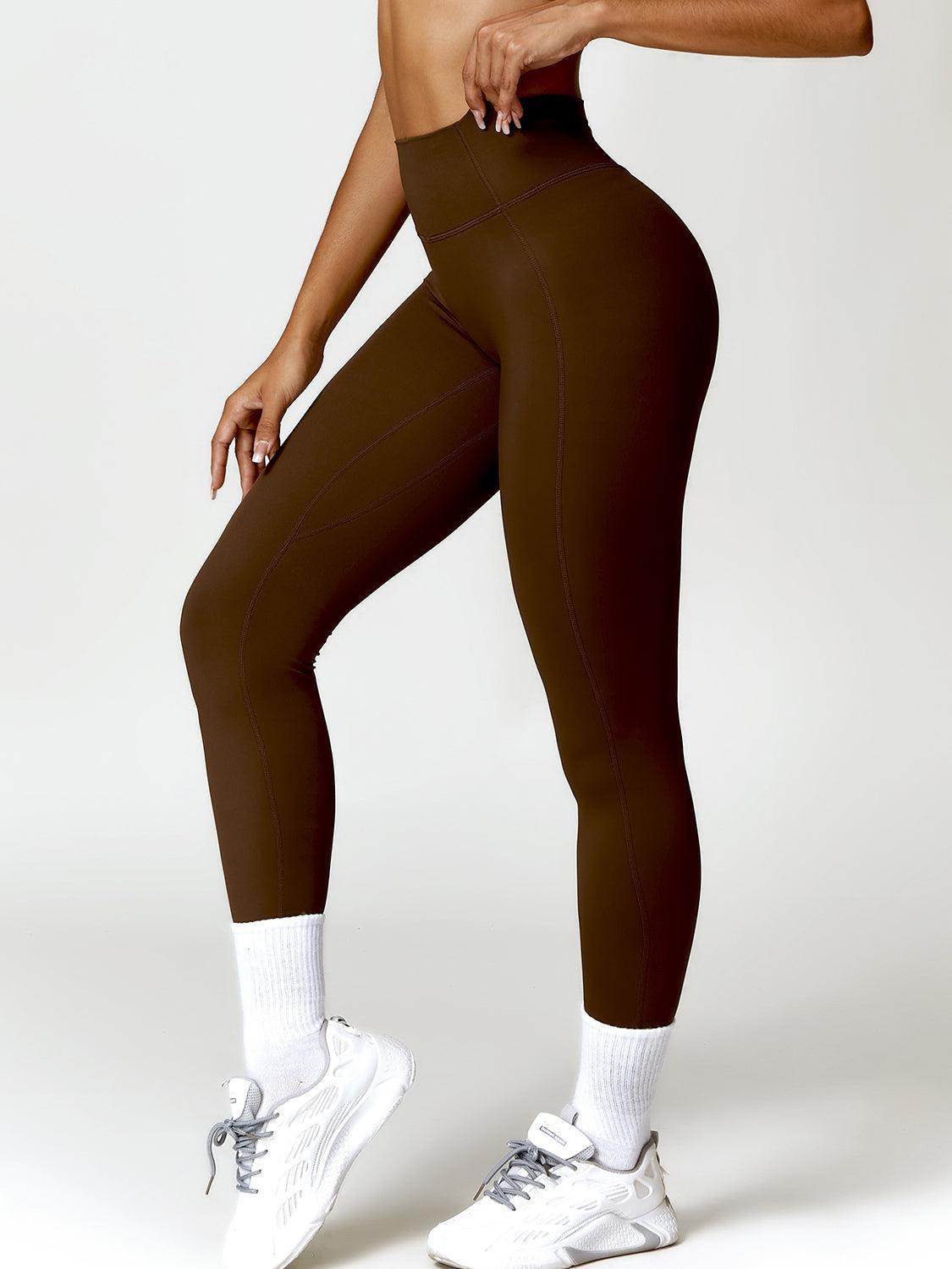 a woman in a brown sports bra top and leggings