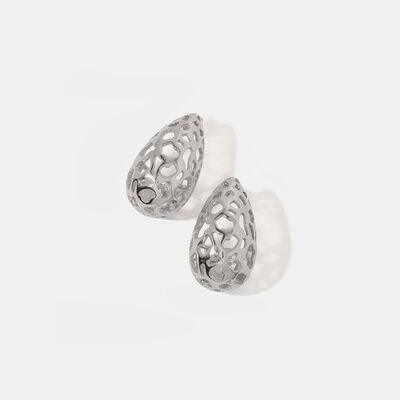 a pair of silver earrings on a white background