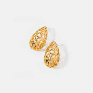 a pair of gold earrings on a white background