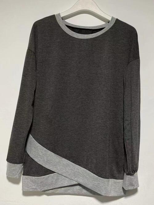 a gray sweater with a grey stripe on the side