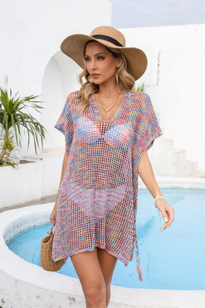 a woman standing next to a pool wearing a hat