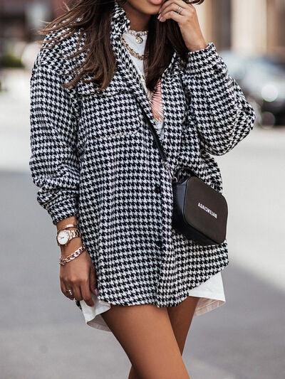 a woman in a black and white coat and hat