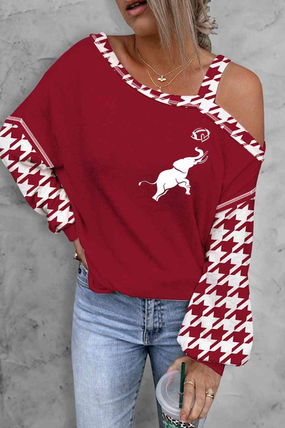 a woman wearing a red and white sweater with a dog on it