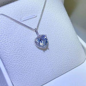 a necklace with a heart shaped diamond on it