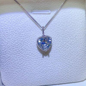 a necklace with a heart shaped diamond on it