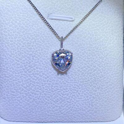 a necklace with a heart shaped blue stone