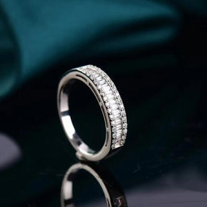 a diamond ring sitting on top of a table