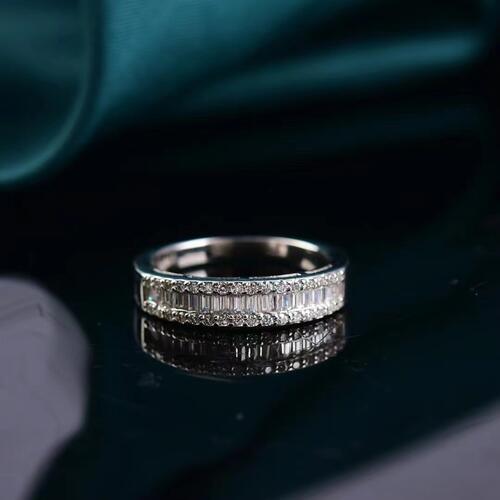 a diamond ring sitting on top of a table