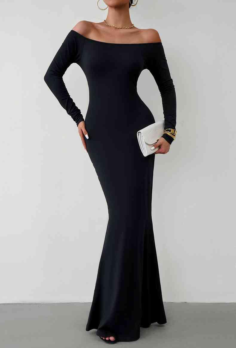 a woman in a long black dress