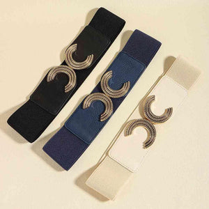 a pair of black and white belts on a white surface