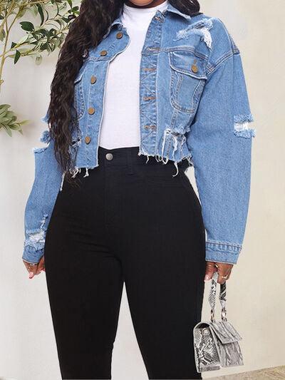 a woman wearing a jean jacket and black pants
