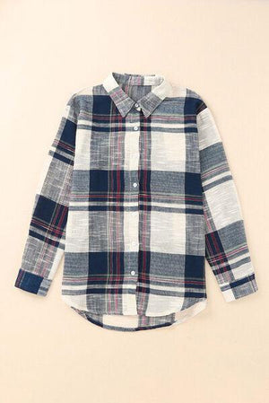 a boy's blue and white plaid shirt