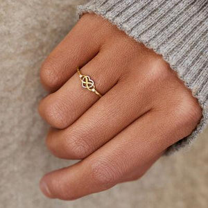 a close up of a person wearing a ring