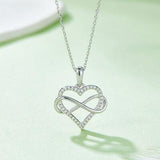 a heart shaped pendant with a diamond accent