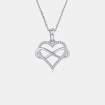 a heart shaped pendant with a diamond accent