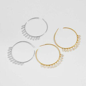 three pairs of hoop earrings with pearls