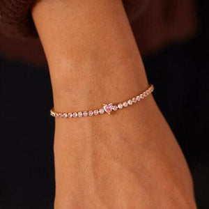 a close up of a person wearing a bracelet