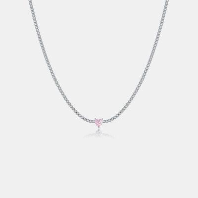 a necklace with a pink heart on it