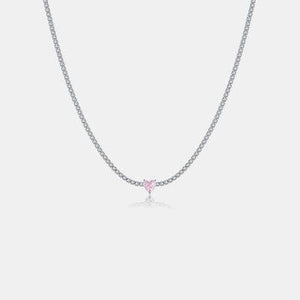 a necklace with a pink heart on it