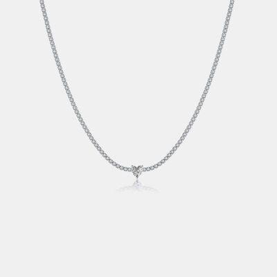 a diamond necklace on a white background