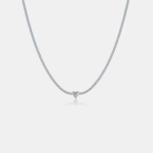 a diamond necklace on a white background