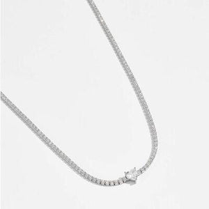 a diamond necklace on a white background