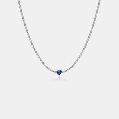 a necklace with a blue heart on a chain