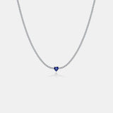 a necklace with a blue heart on a chain