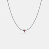 a necklace with a heart on a chain