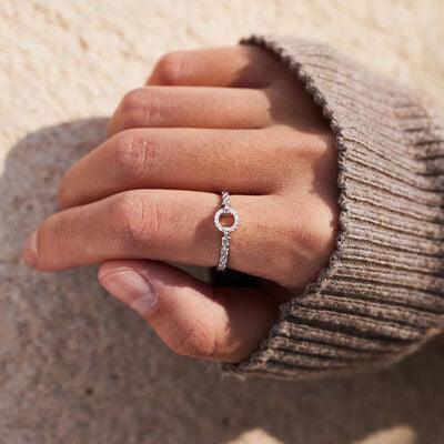 a woman's hand with a diamond ring on it