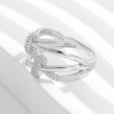 a white gold ring with diamonds on a white background