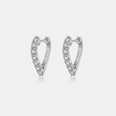 a pair of silver earrings with crystal stones