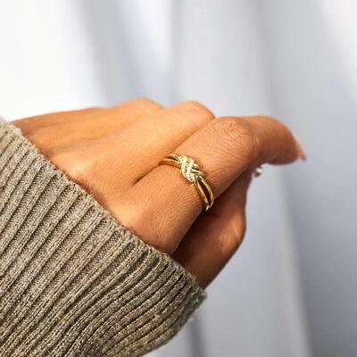 a woman's hand with a ring on it