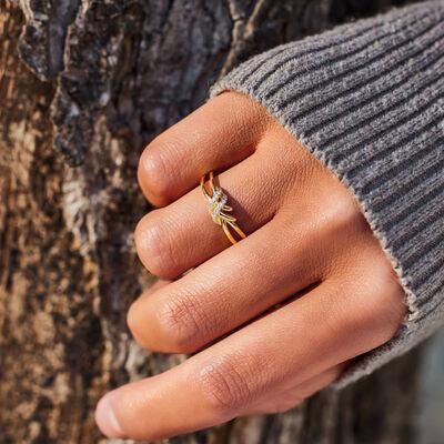 a person's hand with a ring on it