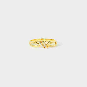 a gold ring with a single diamond