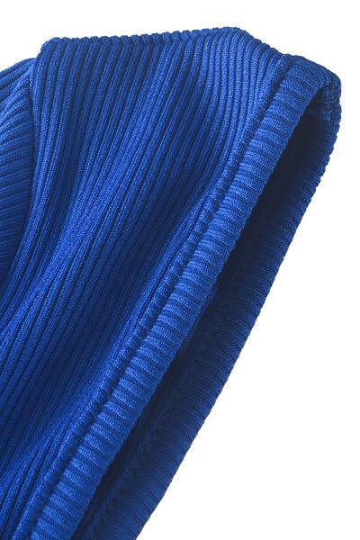 a close up of a blue sweater on a white background