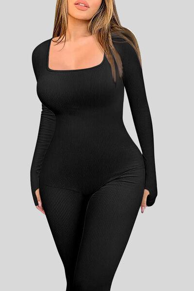 a woman in a black bodysuit