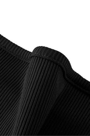 a close up of a black pleated shirt
