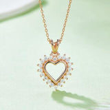 a heart shaped necklace with a diamond center
