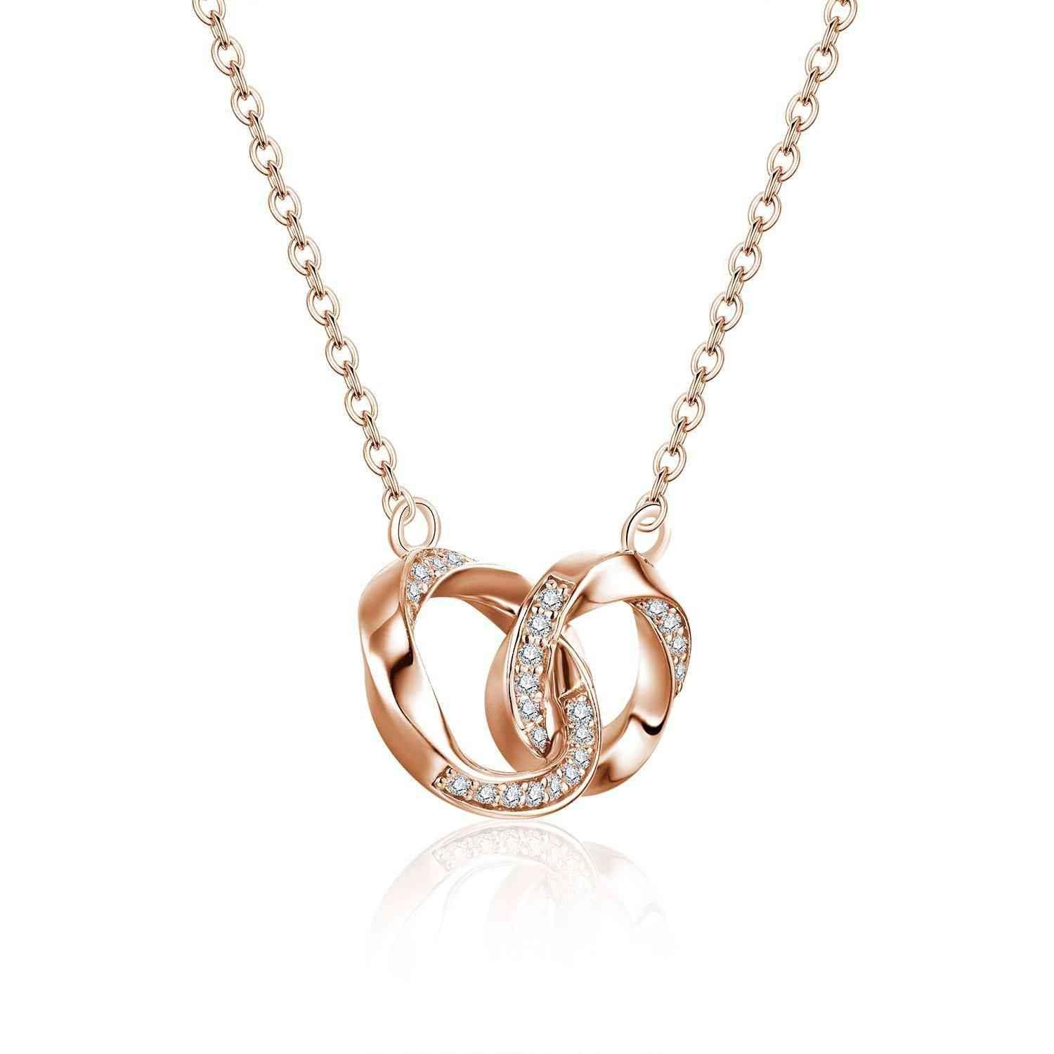 a rose gold necklace with two intertwined hearts