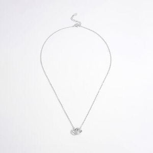 a silver necklace with a heart on it
