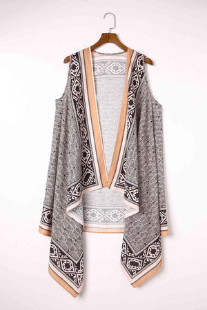 a cardigan sweater hanging on a hanger