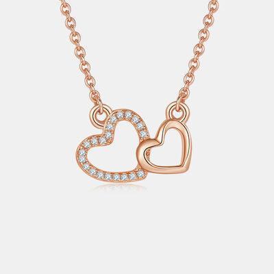 a necklace with two hearts on a chain