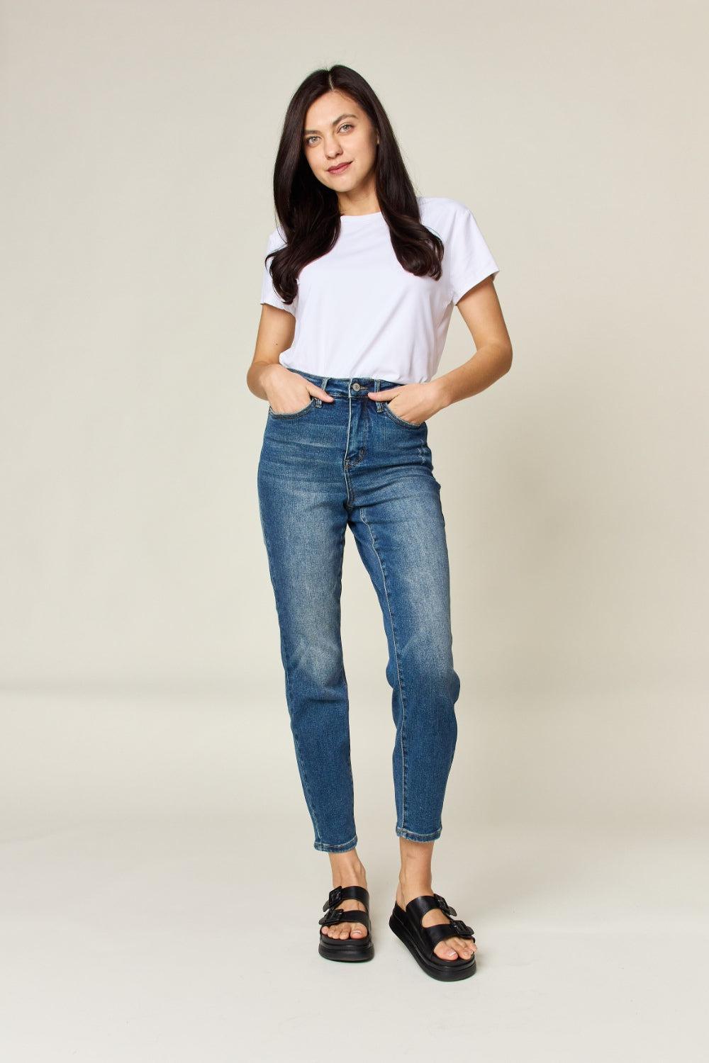 a woman in a white t - shirt and jeans